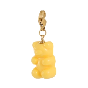 Macro view of a translucent yellow gummy bear pendant with a golden lobster clasp