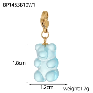 Macro shot of light blue gummy bear pendant with golden clasp and size dimensions