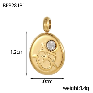 Macro view of gold stainless steel Om symbol pendant with crystal inlay and measurements