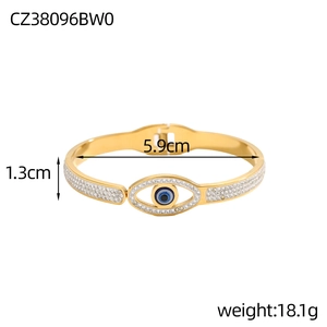 Detailed view of evil eye spring bracelet with white crystals and enamel accents