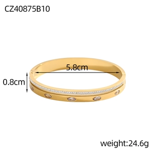 Detail showing gold stainless steel bangle dimensions 5.8cm diameter and 0.8cm width