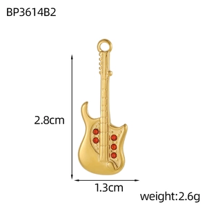 Detailed size view of a gold guitar pendant with red zircons, height 2.8cm, width 1.3cm