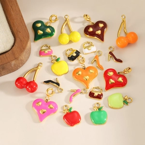 Detailed view of colorful enamel high heel and cherry charms for DIY jewelry making