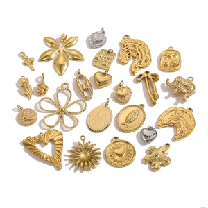 Variety of polished gold and silver stainless steel jewelry charms and animal pendants
