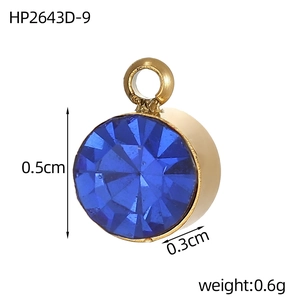 Detail view of small round 0.5cm stainless steel gold pendant with blue birthstone