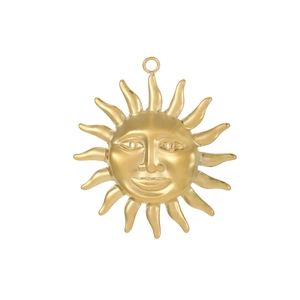 Macro shot of 18K gold-plated stainless steel sun pendant with face engraving