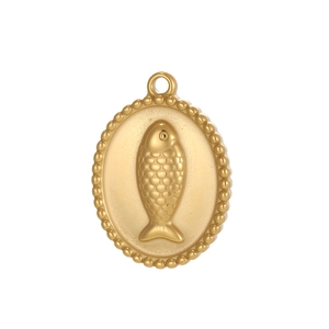 Macro detail of oval gold stainless steel pendant with embossed fish pattern and beaded edge