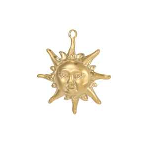 Macro shot of gold sun face pendant with detailed rays and a polished jewelry loop