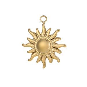 Detail of golden stainless steel sun pendant featuring textured rays and a polished loop
