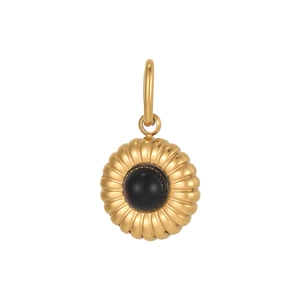 Macro detail of gold-plated sunburst pendant with a black stone center and large bail