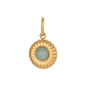 Macro detail of gold round pendant with radial sunburst texture and blue gemstone