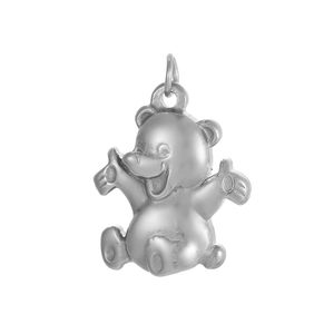 Detailed close-up of a smiling silver teddy bear pendant with a polished metal finish
