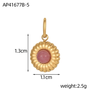 Macro view of gold stainless steel ribbed round pendant with pink natural stone and sizing