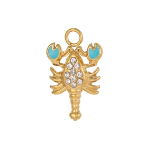 Detailed macro view of golden lobster pendant with blue enamel and sparkling crystals