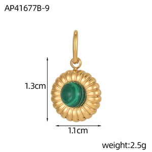 Macro view of a sunburst textured gold pendant featuring a round malachite gemstone inlay
