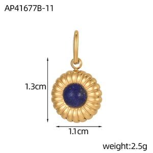 Macro view of gold round pendant with blue natural stone inlay and ribbed texture details