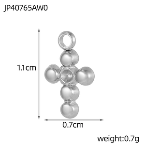 Detailed macro view of silver polished spherical cross pendant showing dimensions 1.1x0.7cm