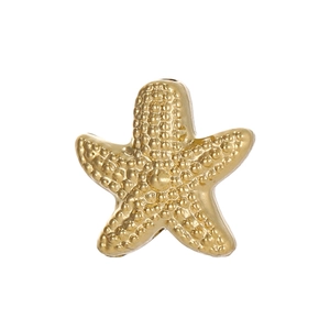Macro detail of matte gold starfish pendant with embossed dot texture for DIY jewelry