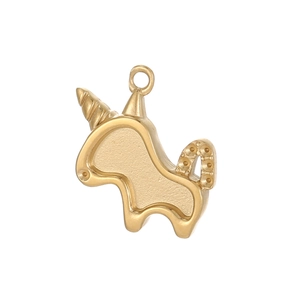 Detail of a golden unicorn pendant with matte texture and polished edges for DIY jewelry