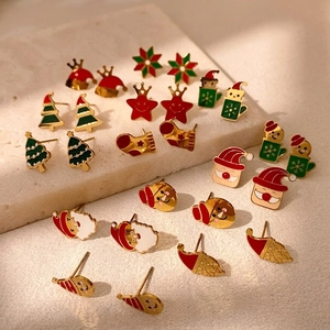 Christmas earrings set featuring festive trees and Santa pendants in gold plated steel