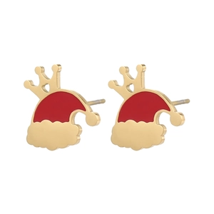 Macro detail of Christmas hat earrings with crown design and red enamel finish