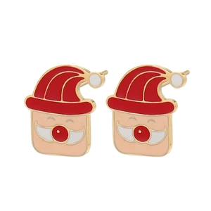 Detailed close-up of cute enamel Santa Claus earrings with red hat and gold metal trim
