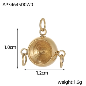 Macro detail of gold geometric jewelry pendant with inner spiral texture and size labels