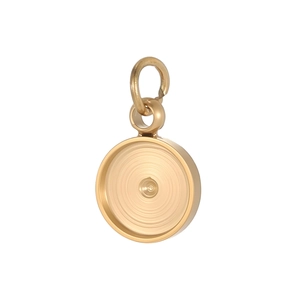 Close-up of polished gold-finished stainless steel round pendant base for DIY jewelry making