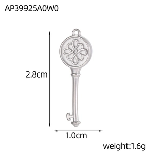 Detailed view of silver key pendant with geometric pattern and 2.8cm size markings