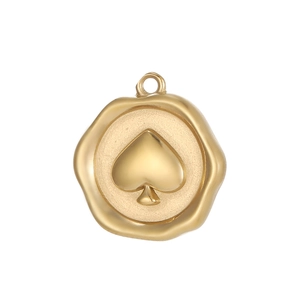 Detailed macro view of a vintage gold spade wax seal pendant with irregular edges