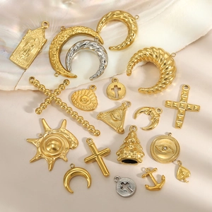 Golden vintage stainless steel religious pendants including cross, moon, and sun charms