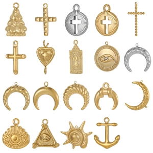 Golden stainless steel celestial and religious pendants in a diverse grid display