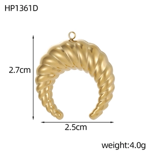 Detailed view of a golden croissant pendant with dimensions 2.7x2.5cm and 4.0g weight