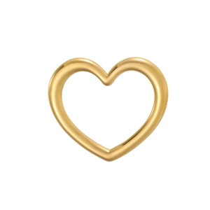 Macro detail of polished heart-shaped gold pendant with a smooth metallic finish