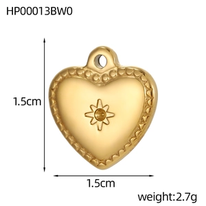 Detail of a 1.5cm golden heart pendant with a star engraving and beaded edge detail