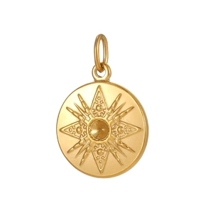 Detailed close-up of golden stainless steel sunburst pendant with embossed star pattern