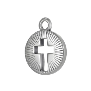 Macro view of a stainless steel circular pendant with cut-out cross and sunburst texture