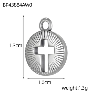 Detail view of round stainless steel cross pendant with radial engraving and dimensions