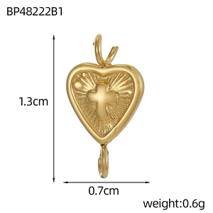 Detailed macro view of gold-plated stainless steel heart cross pendant with size metrics