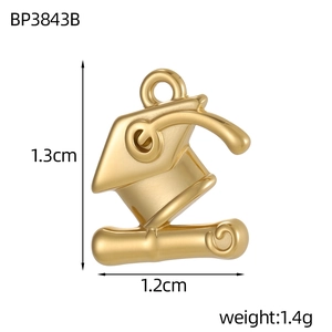 Detailed view of a gold graduation cap and scroll pendant showing 1.3cm dimensions