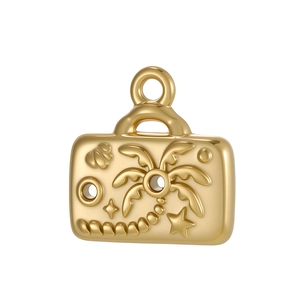 Macro view of gold stainless steel travel suitcase pendant with tropical palm and starfish