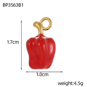 Detail shot of red enamel bell pepper pendant with dimensions 1.7cm and golden loop
