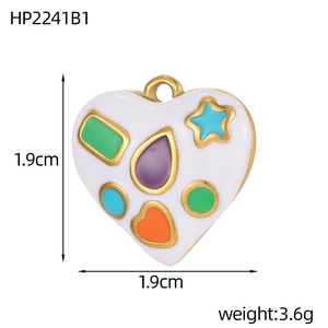 Detail showing white enamel heart charm with colorful patterns and gold finish