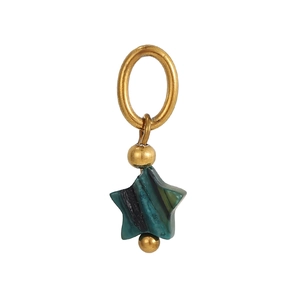 Detail of star-shaped turquoise charm with golden beads and polished metal ring