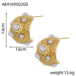 Detail view of gold C-shaped earrings with hammered texture and faux pearls, 1.6cm size