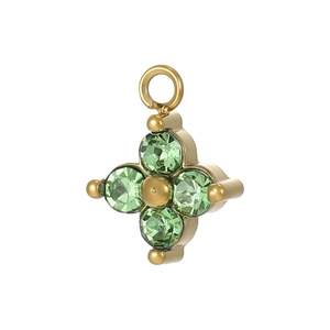 Detailed view of a gold clover pendant with four sparkling green round-cut crystals