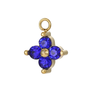 Detail showing gold cross pendant with four dark blue round crystals and top ring