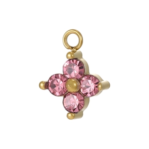 Detailed close-up of a gold-plated flower pendant with four pink cubic zirconia stones