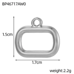 Detail view of rectangular silver pendant showing 1.5cm by 1.7cm dimensions and scale