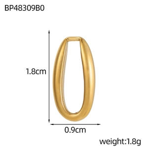 Detail view of oval gold heart pendant showing dimensions of 1.8cm height and 0.9cm width